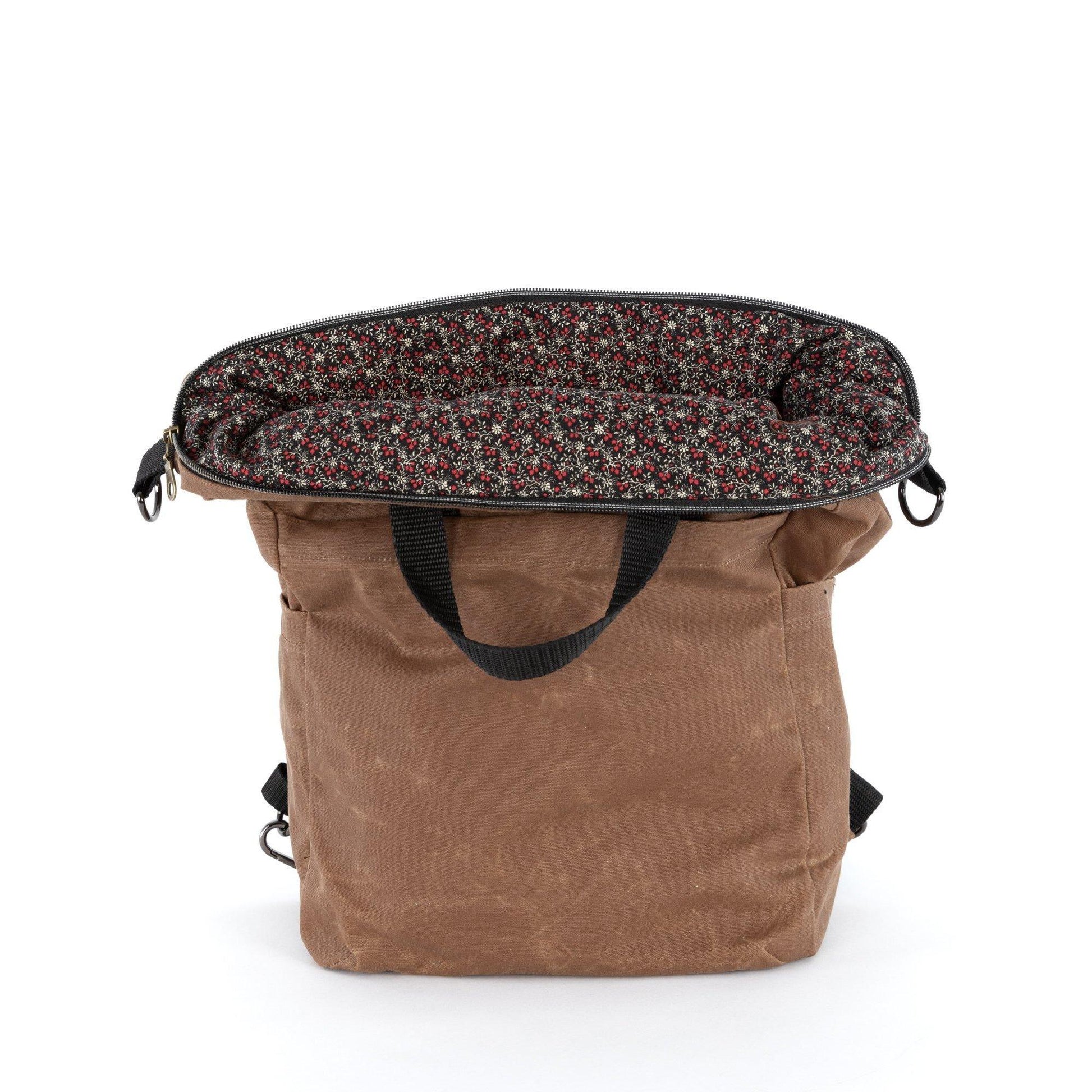 The Vega bag is fully lined. This waxed canvas bag is lined with liberty-style quilting cotton.